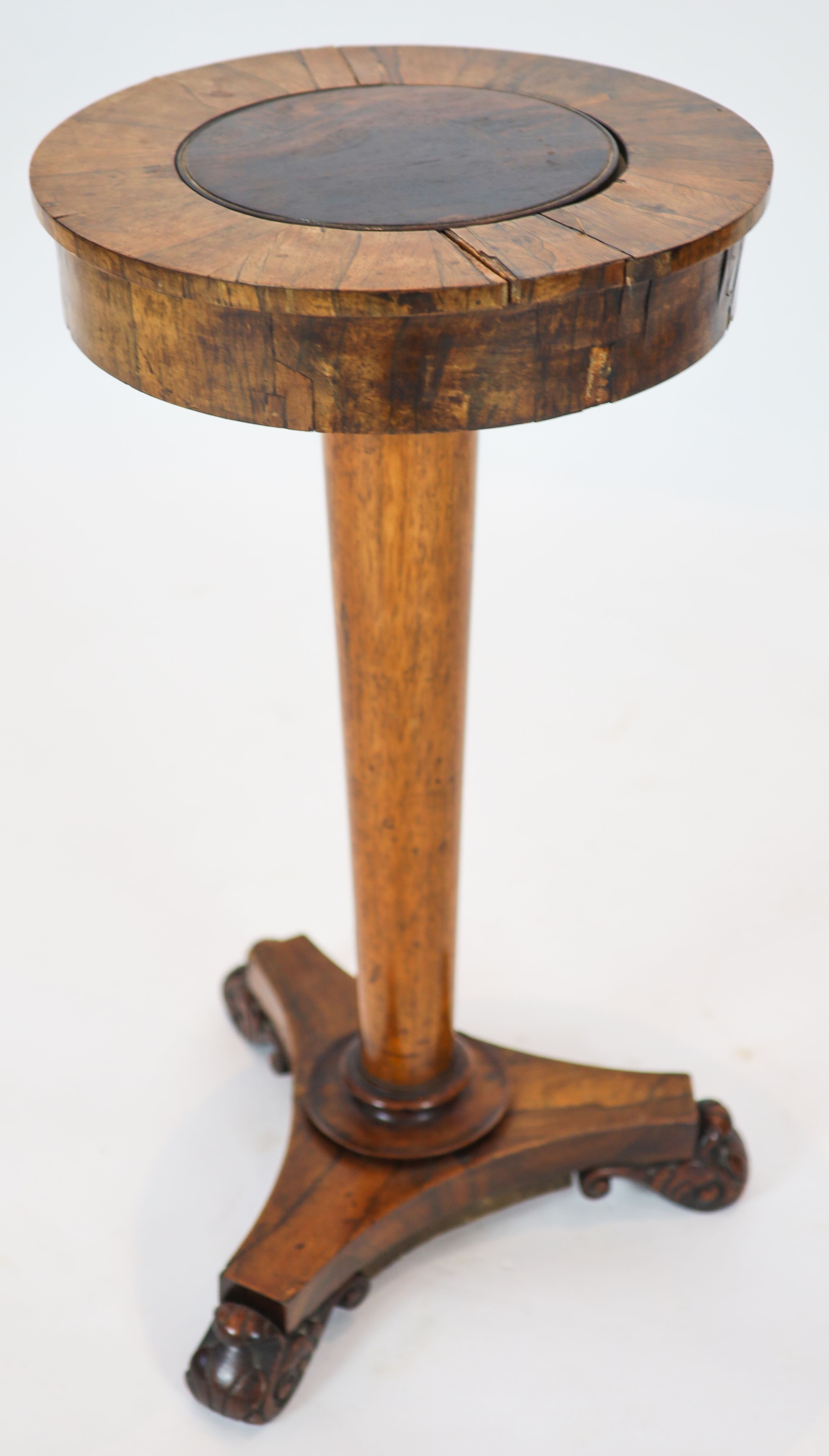 A Regency banded rosewood circular topped work table, raised on tapered, turned pillar, on a triform platform base, diameter 40cm, height 75cm